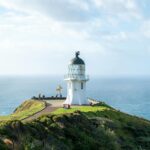cape reinga lighthouse on sea coast in new zealand
